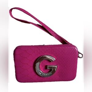 Guess pink Textured Wristlet clutch with interior card holders.